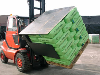The KAUP Pallet Turnover Clamp with Pusher T451WA on duty.